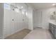 Modern bathroom featuring an oversized shower with decorative tile at 17644 W Rancho Dr, Litchfield Park, AZ 85340