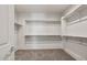 Spacious walk-in closet with ample shelving at 17644 W Rancho Dr, Litchfield Park, AZ 85340