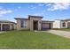 Modern home with stone accents and a two-car garage at 18221 E Paria Canyon Dr, Rio Verde, AZ 85263