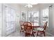 Cozy breakfast nook with wood table and chairs, adjacent to kitchen at 19098 N 97Th Ln, Peoria, AZ 85382