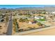 Aerial view of two houses on a large lot with a fenced backyard at 19350 W Clarendon Ave, Litchfield Park, AZ 85340