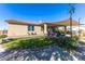 Backyard view showing patio, grass, and landscaping at 19350 W Clarendon Ave, Litchfield Park, AZ 85340