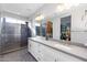 Elegant bathroom with double sinks, a large shower and modern vanity at 19350 W Clarendon Ave, Litchfield Park, AZ 85340