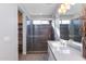 Bathroom with a walk-in shower and modern vanity at 19350 W Clarendon Ave, Litchfield Park, AZ 85340