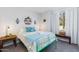 Bright bedroom with a green metal bed frame and light blue bedding at 19350 W Clarendon Ave, Litchfield Park, AZ 85340