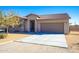 Single-story home with stone accents and a two-car garage at 19350 W Clarendon Ave, Litchfield Park, AZ 85340