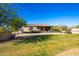 House with a large backyard and green lawn at 19350 W Clarendon Ave, Litchfield Park, AZ 85340