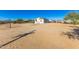 View of a house from a distance with sandy surrounding at 19350 W Clarendon Ave, Litchfield Park, AZ 85340