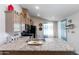 Modern kitchen with granite countertops and stainless steel appliances at 19350 W Clarendon Ave, Litchfield Park, AZ 85340