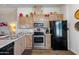 Well-equipped kitchen featuring stainless steel appliances and ample cabinetry at 19350 W Clarendon Ave, Litchfield Park, AZ 85340