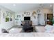 Living room with sectional sofa, TV, and western-themed decor at 19350 W Clarendon Ave, Litchfield Park, AZ 85340