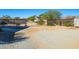 Large yard with gravel and a metal fence at 19350 W Clarendon Ave, Litchfield Park, AZ 85340