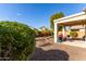 Desert landscape with covered patio and seating at 20518 N 261St Ave, Buckeye, AZ 85396