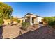 Landscaped backyard with gravel and shrubs at 20518 N 261St Ave, Buckeye, AZ 85396