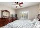 Bedroom with dresser and large bed at 20518 N 261St Ave, Buckeye, AZ 85396