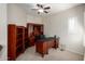 Home office with built-in wooden desk and shelving at 20518 N 261St Ave, Buckeye, AZ 85396