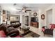 Bright living room with comfortable furniture and large TV at 20518 N 261St Ave, Buckeye, AZ 85396