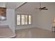 Bright dining area with a ceiling fan and large window at 20619 N Echo Mesa Dr, Sun City West, AZ 85375