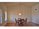 Dining room with wood floors and a chandelier at 20619 N Echo Mesa Dr, Sun City West, AZ 85375