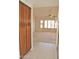 Bright entryway with tile flooring and wood cabinets at 20619 N Echo Mesa Dr, Sun City West, AZ 85375