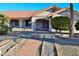 One-story home with terracotta tile roof, landscaped yard, and walkway at 20619 N Echo Mesa Dr, Sun City West, AZ 85375