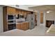 Kitchen with stainless steel appliances and wood cabinets at 20619 N Echo Mesa Dr, Sun City West, AZ 85375