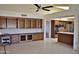 Kitchen with breakfast bar and built-in shelving at 20619 N Echo Mesa Dr, Sun City West, AZ 85375