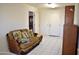 Cozy living room with tiled floor and a couch at 20619 N Echo Mesa Dr, Sun City West, AZ 85375