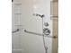 Close-up view of a shower with grab bars and multiple shower heads at 20619 N Echo Mesa Dr, Sun City West, AZ 85375