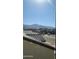 Aerial view of houses and mountain landscape in the background at 20811 N 223Rd Ave, Surprise, AZ 85387