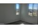 Bedroom with carpet floors and two windows with mountain view at 20811 N 223Rd Ave, Surprise, AZ 85387