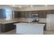 Modern kitchen with dark brown cabinets and white countertops at 20815 N 223Rd Ave, Surprise, AZ 85387