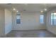 Spacious living room with tile floors and large windows at 20815 N 223Rd Ave, Surprise, AZ 85387