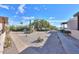 Spacious backyard with gravel pathway and mature desert plants at 221 E Nebraska St, Florence, AZ 85132