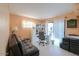 Home office with built-in shelving and sliding door access to patio at 221 E Nebraska St, Florence, AZ 85132