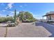 Landscaped yard with gravel, desert plants, and seating at 221 E Nebraska St, Florence, AZ 85132