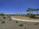 Playground with swings, slides and a walking path nearby at 24151 W Hidalgo Ave, Buckeye, AZ 85326