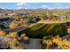 Aerial view of community park with grassy areas, trees, and a covered pavilion at 2425 W Bronco Butte Trl # 2037, Phoenix, AZ 85085