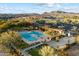 Aerial view of community pool, with a large pool, spa, and surrounding lounge areas at 2425 W Bronco Butte Trl # 2037, Phoenix, AZ 85085