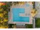 Directly above view of L-shaped community pool with surrounding lounge chairs at 2425 W Bronco Butte Trl # 2037, Phoenix, AZ 85085