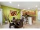 Kitchen and dining area with wood table, chairs, and a view to living room at 2425 W Bronco Butte Trl # 2037, Phoenix, AZ 85085