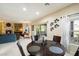 Dining area with round table, four chairs and view of living room at 2425 W Bronco Butte Trl # 2037, Phoenix, AZ 85085