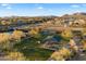 Aerial view of community dog park with ample space and shaded seating areas at 2425 W Bronco Butte Trl # 2037, Phoenix, AZ 85085