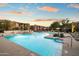 Community pool area with multiple pools and lounge chairs at 2425 W Bronco Butte Trl # 2037, Phoenix, AZ 85085