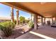 Relaxing backyard patio with covered seating and desert landscaping at 25046 S Foxglenn Dr, Sun Lakes, AZ 85248