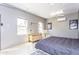 Converted garage features two windows and an air conditioning unit to control the temperature at 25046 S Foxglenn Dr, Sun Lakes, AZ 85248