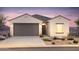 One-story home with two-car garage and desert landscaping at 25144 W Weir Ave, Buckeye, AZ 85326