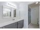 Bathroom boasts a vanity with a large mirror and shower at 2818 S Cottonwood Dr, Tempe, AZ 85282