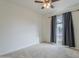 Bright bedroom with ceiling fan and window coverings at 2818 S Cottonwood Dr, Tempe, AZ 85282