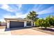 Charming single-story home featuring a two-car garage, beautiful desert landscaping, and a well-maintained front yard at 2818 S Cottonwood Dr, Tempe, AZ 85282